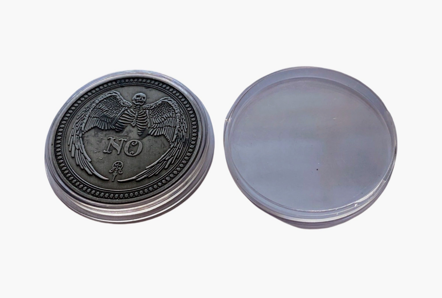 The No side of the Yes/No metal coin and clear plastic case.
Each Destiny Decision Candle comes with a keepsake metal Yes/No flipping coin and plastic case.